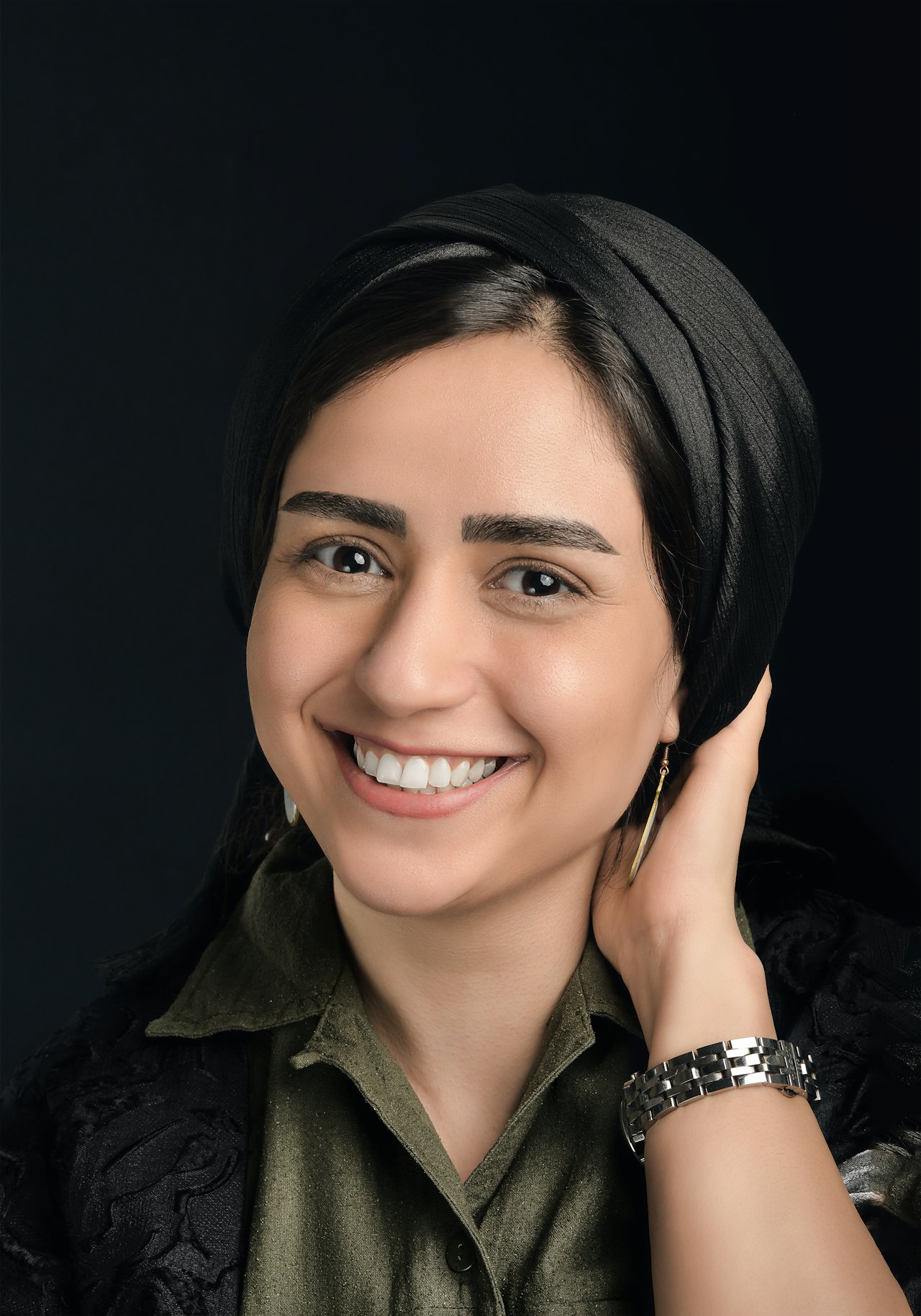 Smiling woman in a dark headscarf